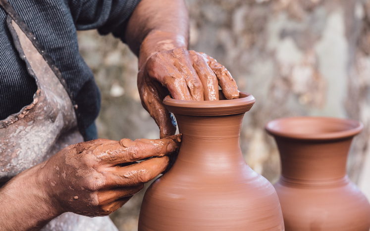 Close-up view of a ceramist making a pottery vase